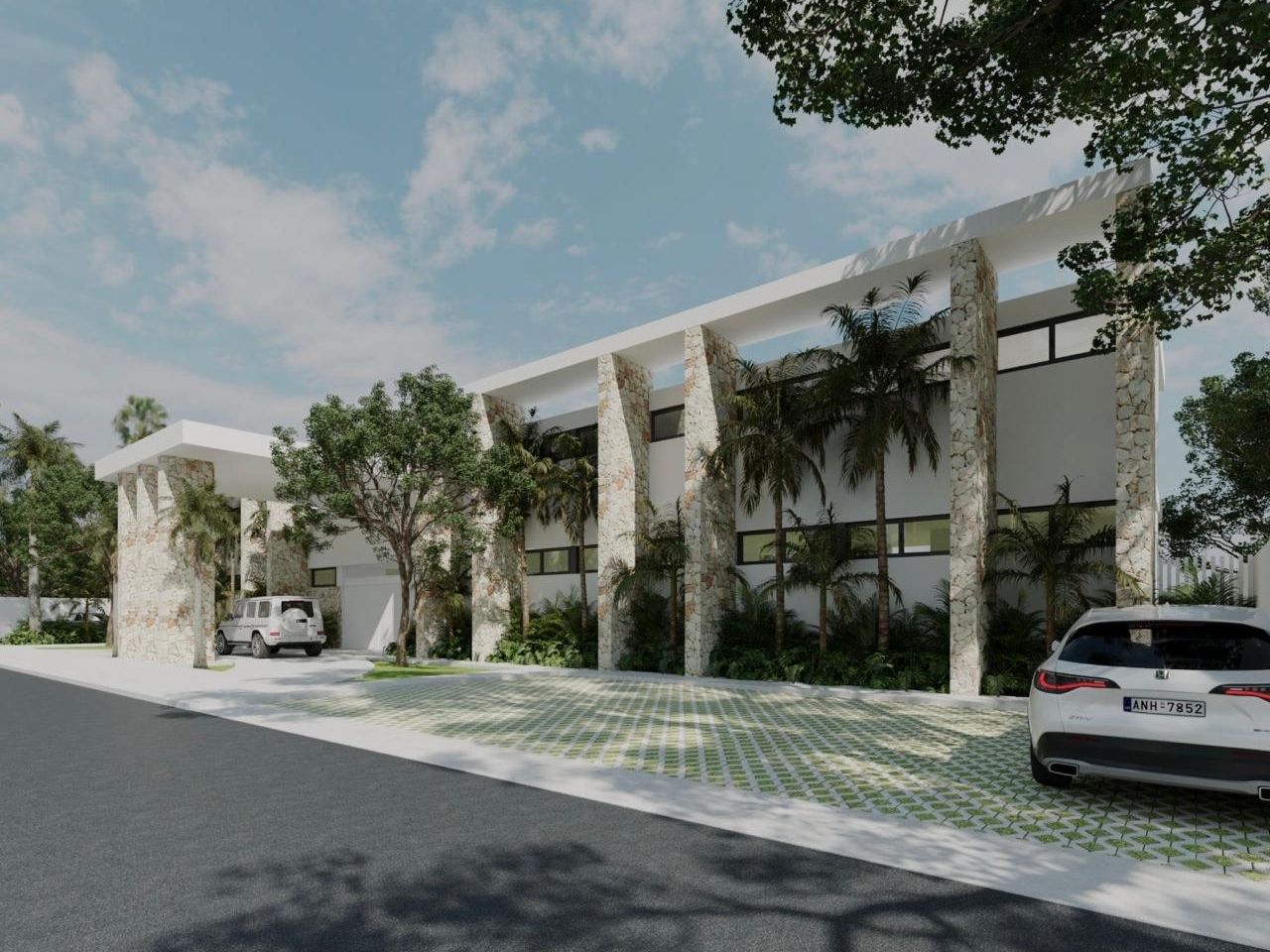 Fachada de Summit College: edificio blanco de dos niveles con pilares de piedra, palmeras y estacionamiento con adocreto